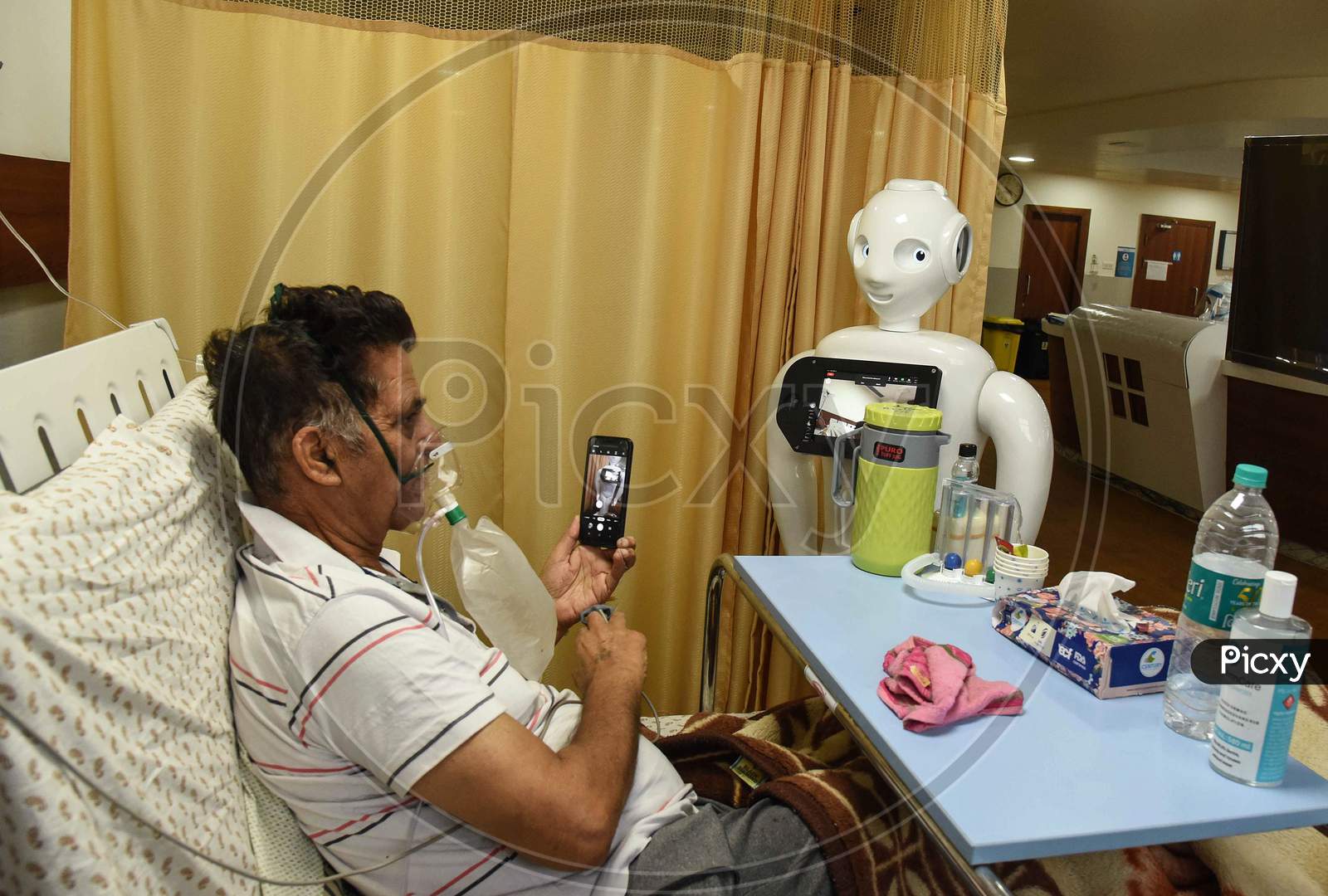 A Private hospital deployed a Robot for the communication in between admitted patients and their families at an ICU Covid ward in Greater Noida. Apart from video call the robot can also record the activities including symptom and thermal checking inside the ICU ward. September 14, 2020.