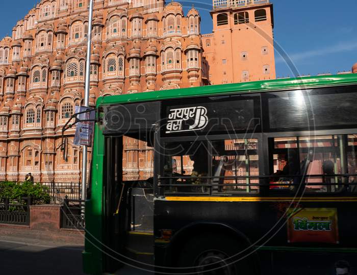 A Jaipur Bus or a low floor bus in front of Hawa Mahal, Jaipur