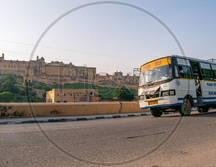 Rajasthan Roadways bus moving on amer road heading towards Jaipur in front of amer fort or amber fort, Jaipur