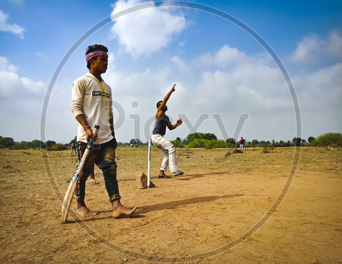Asian Village People Sports Activity On Field.