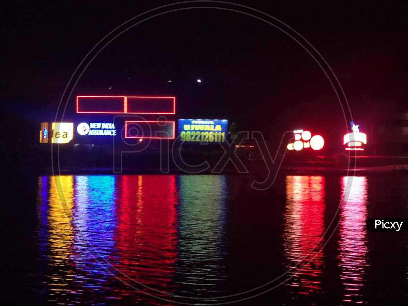 Goa night lights reflection