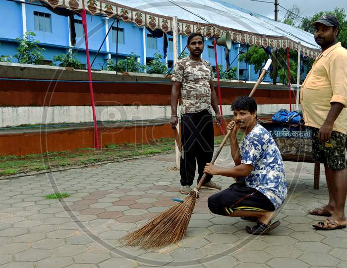 Indian Sweeper On The Job.
