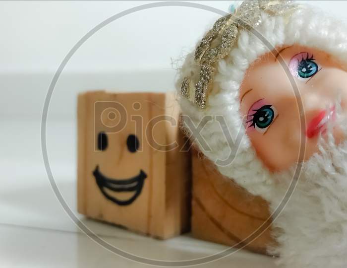 Child face doll with blured smiley face