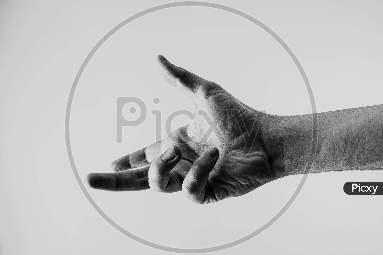 Young Hand In Black And White About To Reach Something With A White Background