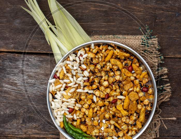 Roasted Corn Seeds And Puffed Rice With Namkeen And Spices In A Plate Isolated On Wooden Background