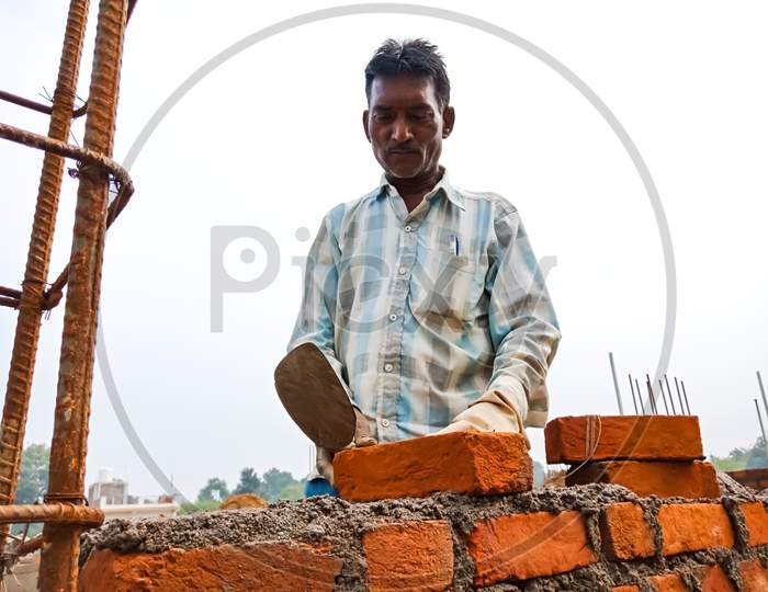 Indian Village Construction Worker On Site.