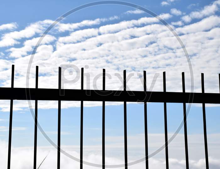 Beautiful Picture Of Gate Of Park, Blue Sky And Clouds In Background