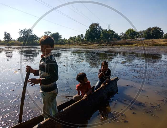 Indian Fisher Kids On Boat.