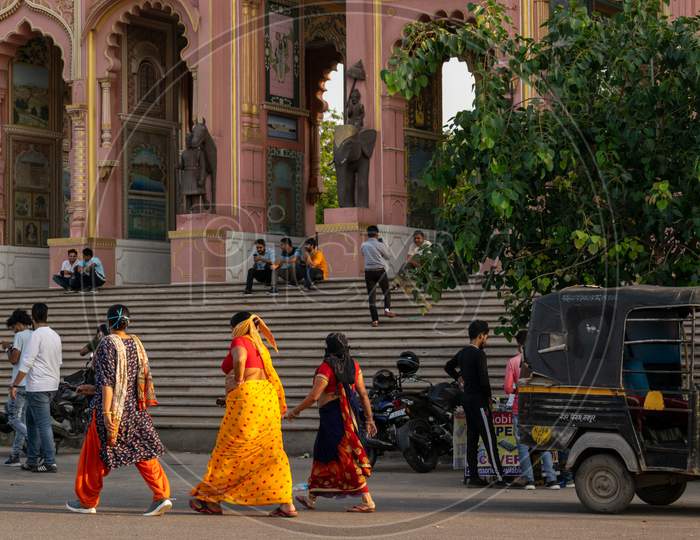 Women wearing masks, for protection against corona virus, do evening walk and visitors visit Patrika Gate near Jawahar Circle Garden in Jaipur, September 2020