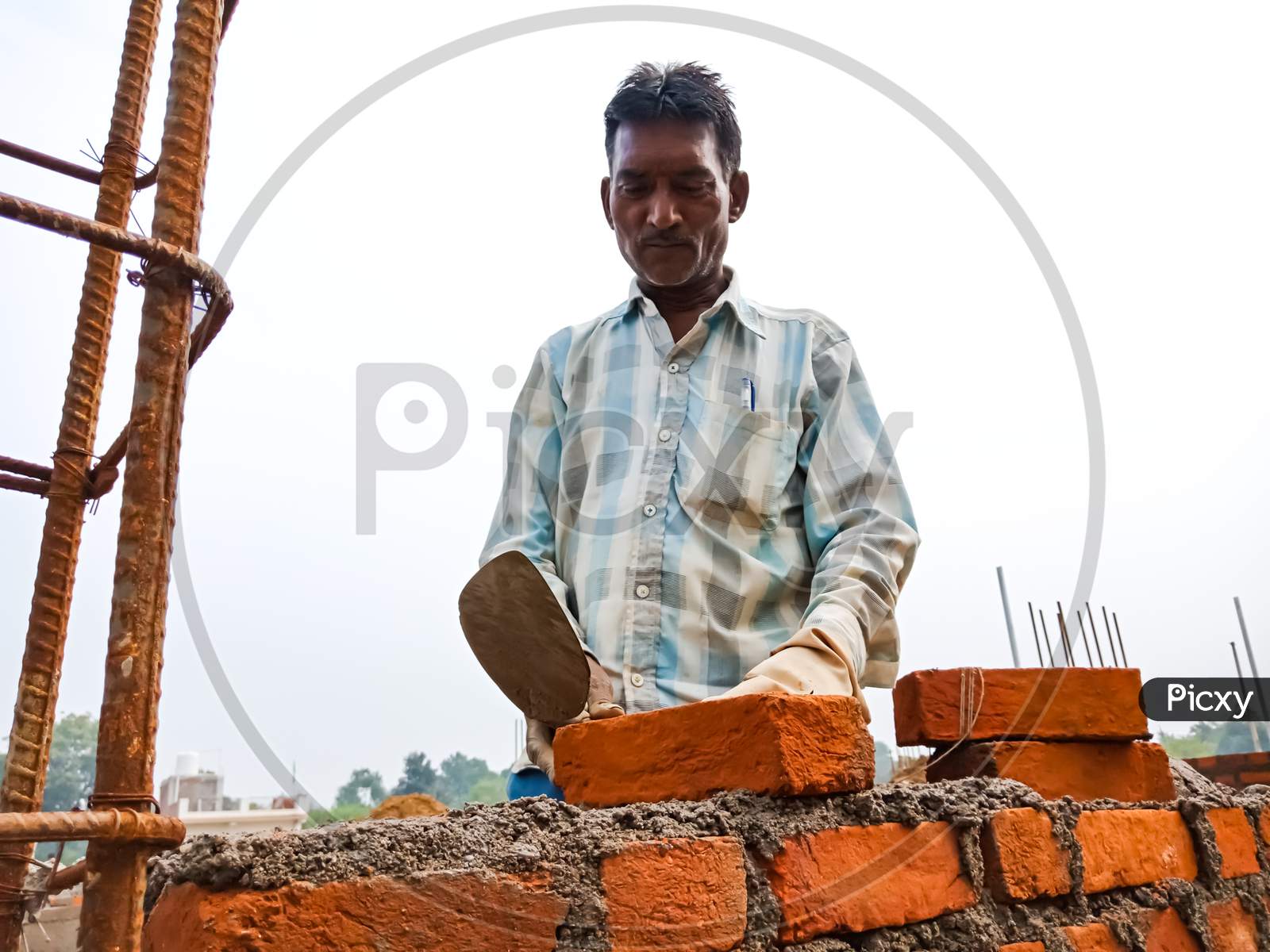 Indian Village Construction Worker On Site.