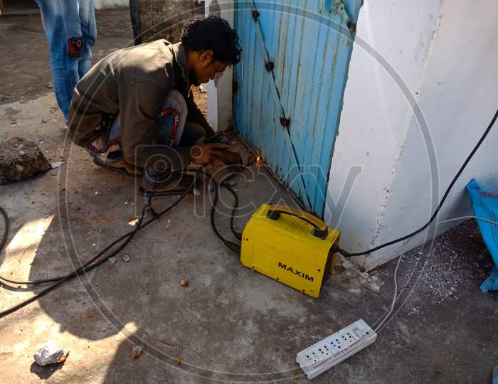 Indian Villager Repairing Work.