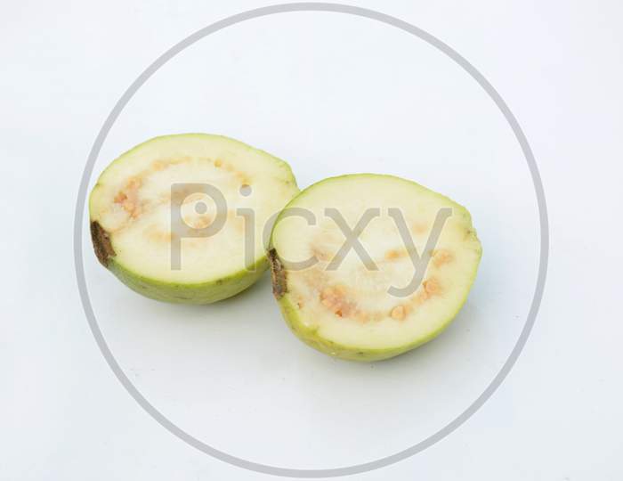 The Sliced Ripe Green White Guava Fruit Isolated On White Background.