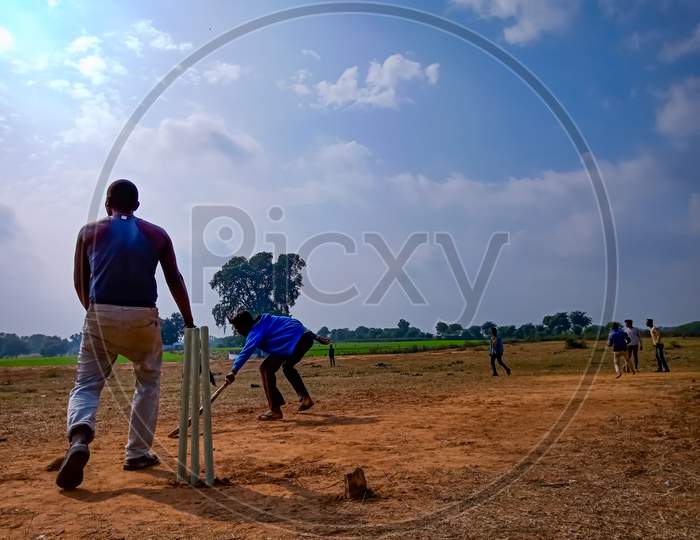 Asian Village People Sports Activity On Field.