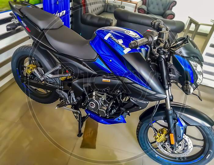 A blue coloured pulsar NS standing for sale