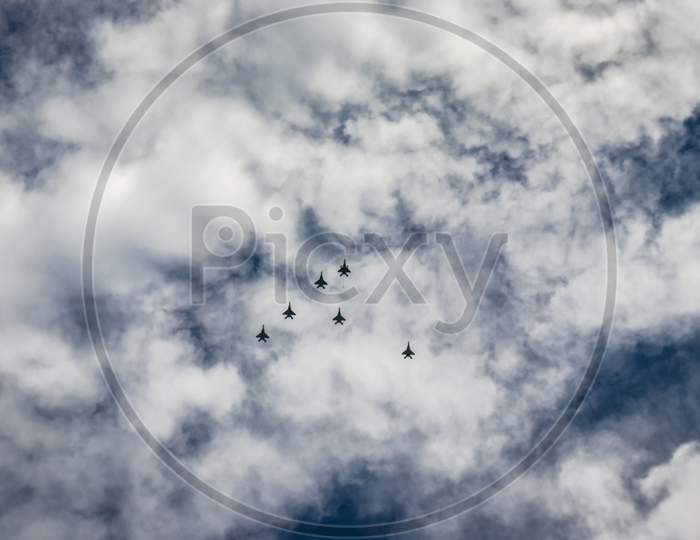 Bright Blue Sky With Jet Fighter Formation Flying