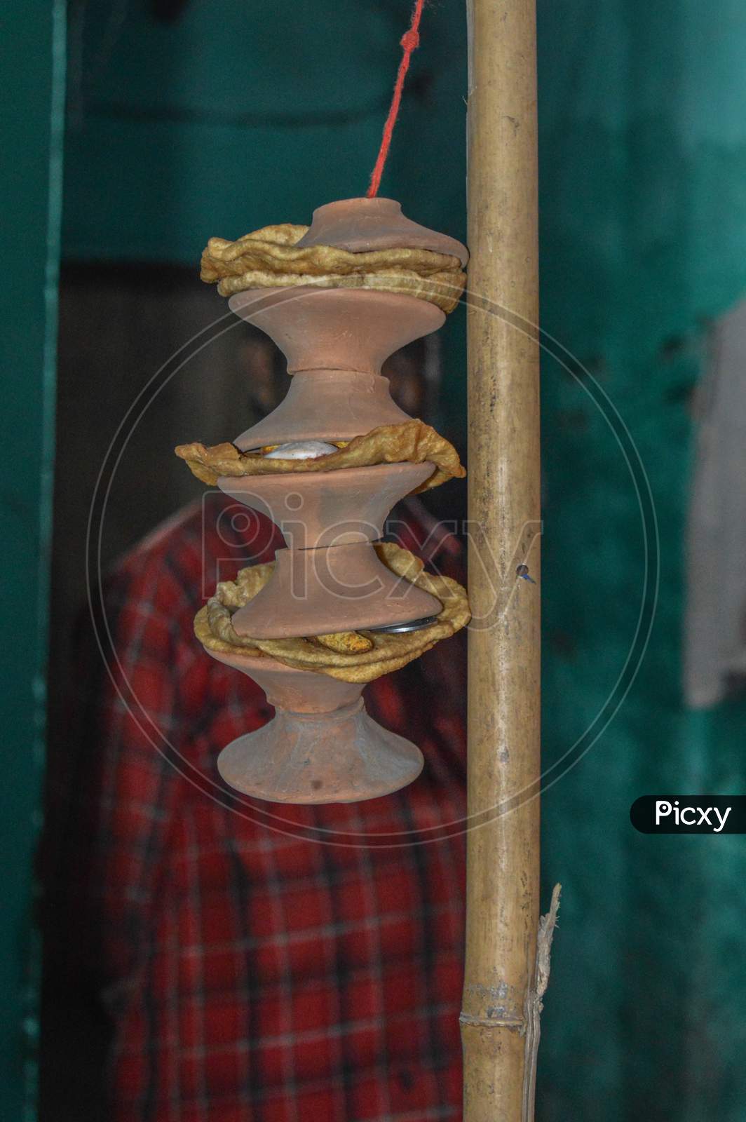 Clay Pot With Food Tie On Stick In Indian Weddings.