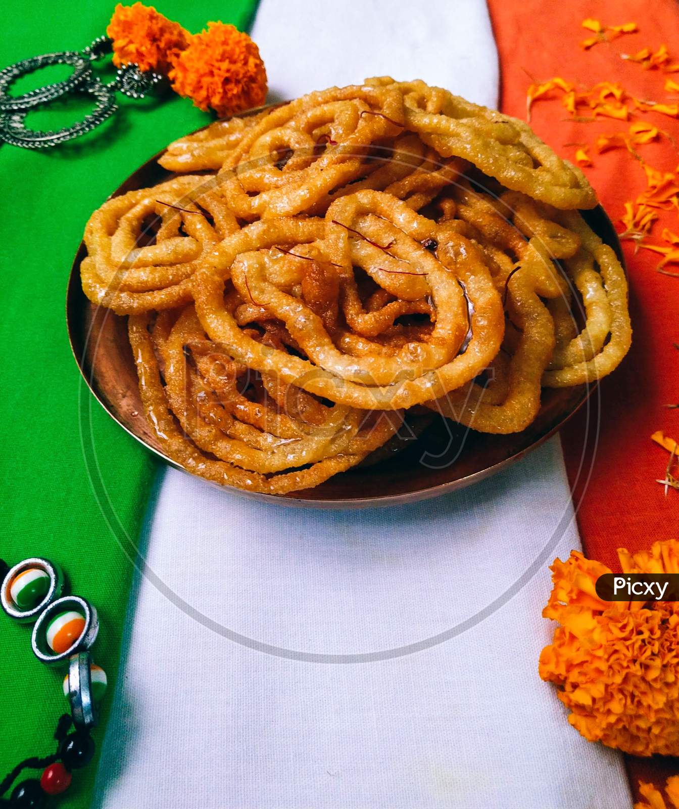 A plate of indian national sweet, crispy and juicy jalebi.