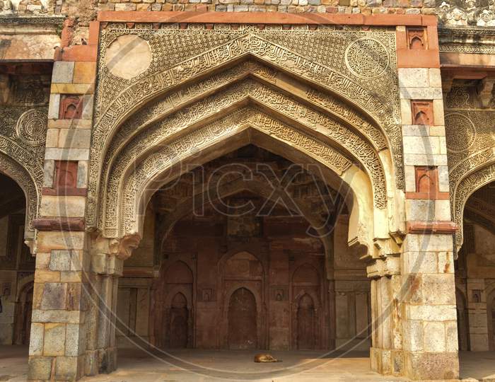 A Design At Bara Gumbad Monument At Lodi Garden Or Lodhi Gardens In A City Park From The Side Of The Lawn At Winter Foggy Morning.