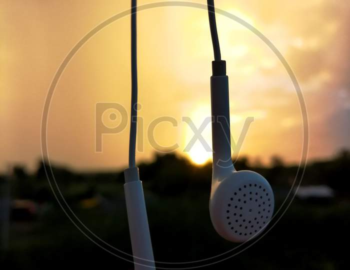 earbuds and sunset