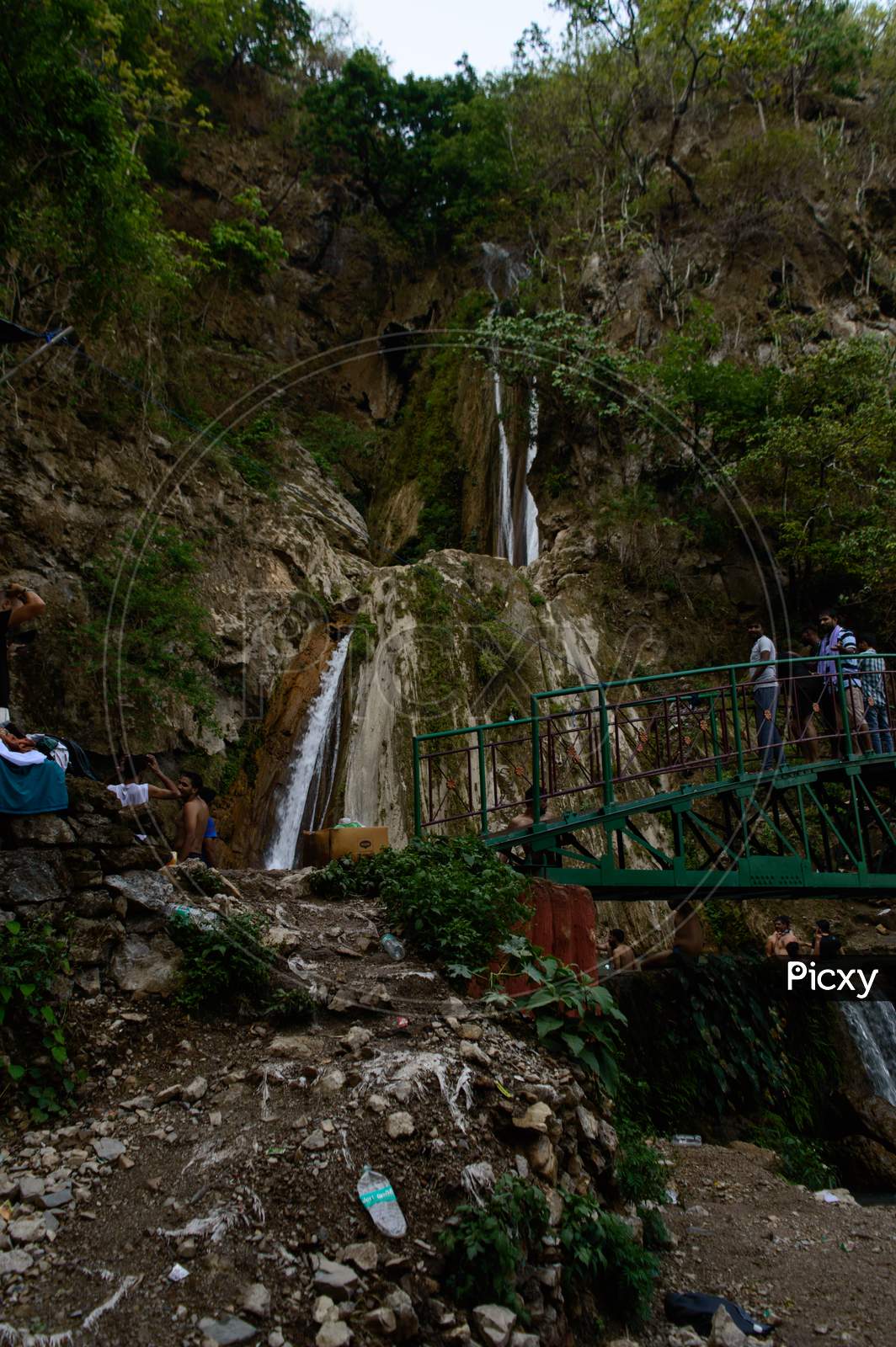 Group Of People Enjoying Under The Famous Neer Garh Waterfall, Rishikesh, Uttarakhand India.