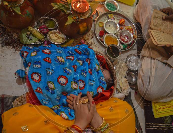 Indian Ritual Baby Lying On Wooden Pan On Ritual Of Namkaran