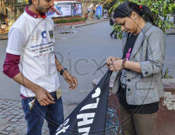 A Indian Boy And Girl Doing Work For Support The Cycle Ride To Celebrate International Women'S Day.