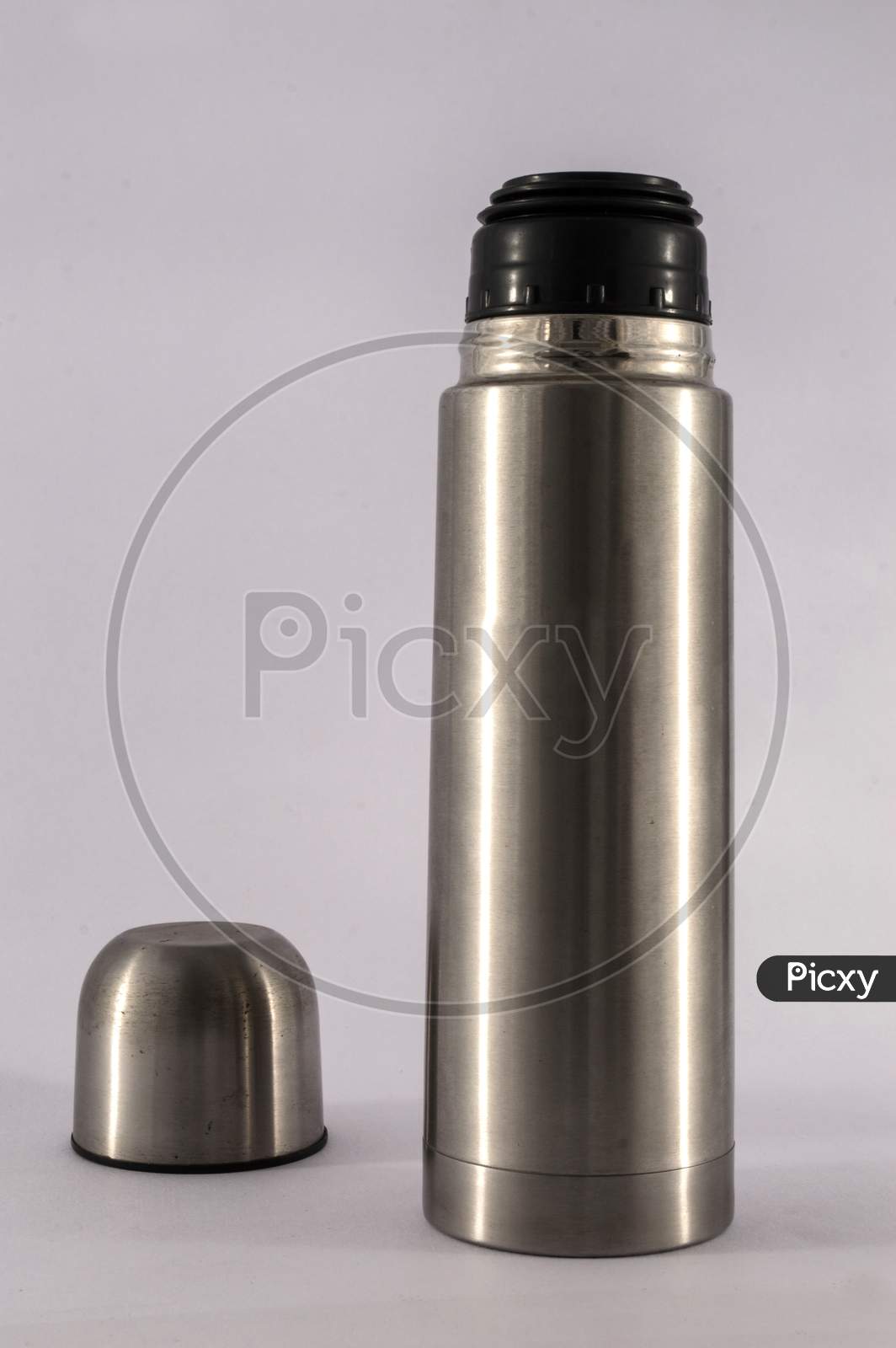 Stainless Steel Vacuum Flask Isolated On The White Background