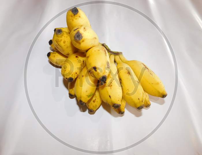 A Bunch Of Bananas Isolated On A White Surface