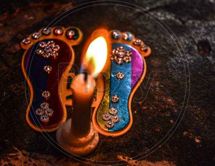 Footprint Of God On Indian Festival Diwali Deepawali With Fire Isolated On Table