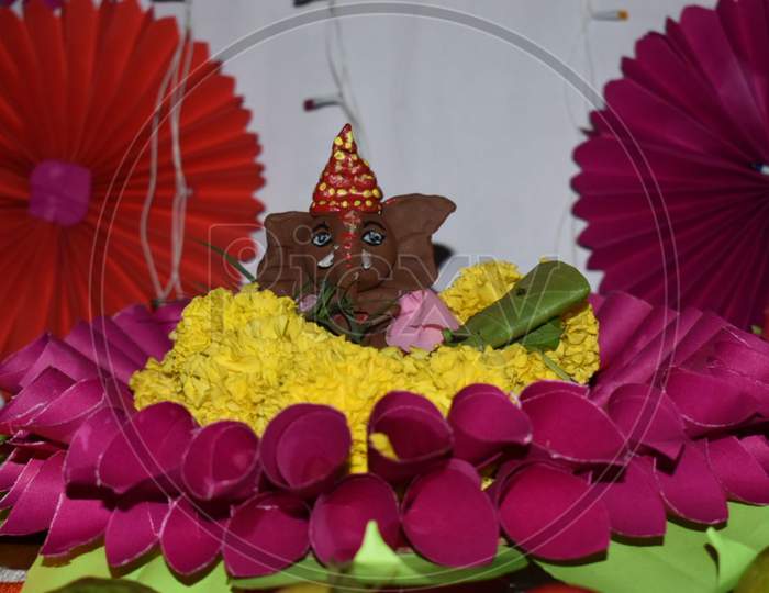 God Ganesha with beautiful flowers
