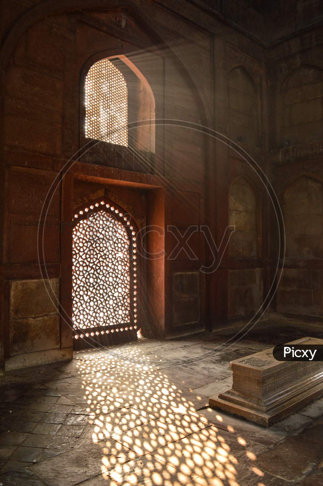 Sun Rays Create Dramatic Light And Shadow Inside Of The Humayun Tomb Memorial At Winter Foggy Morning.