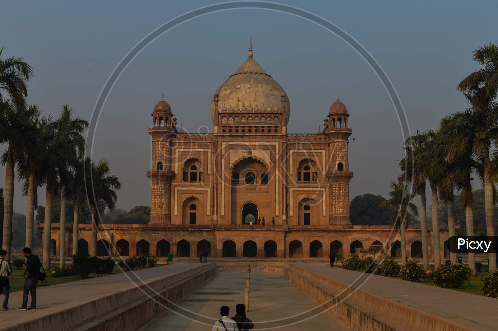 A Bunch Of Photography Students Standing And Taking Picture In-Front Of Safdarjung Tomb Memorial At Winter Morning.