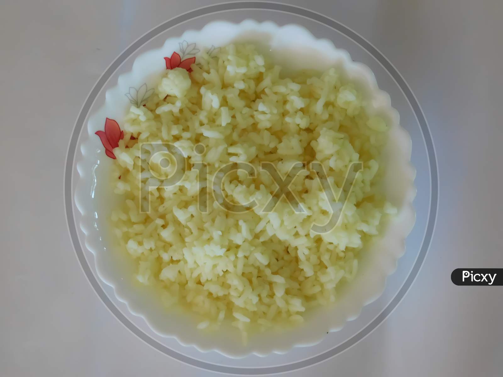 Boiled Rice In A Bowl Isolated On A White Surface