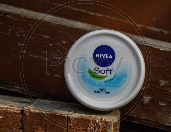 A Product Of Nivea Which Is Moisturize Your Skin Indian Product Isolated On Dusty Wooden At Morning