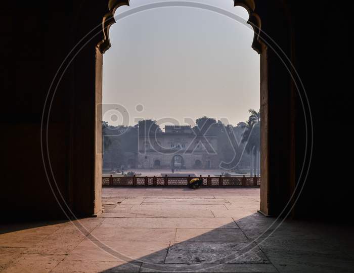 A Mesmerizing View With Sun Rays Create Dramatic Light And Shadow Of Inside The Hall Of Safdarjung Tomb Memorial From The Main Gate,Entrance At Winter Morning.