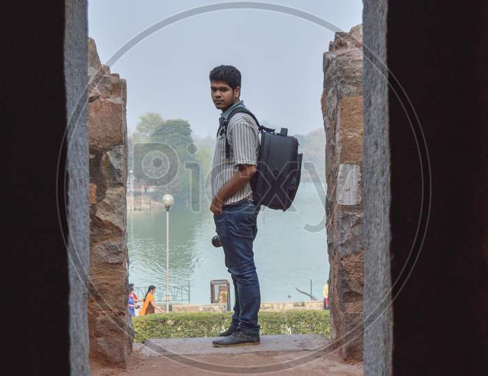 A Indian Guy,Boy With Nikon Camera D750 Doing Photo Shoot And Posing Inside Of Garden And Lake At Morning.