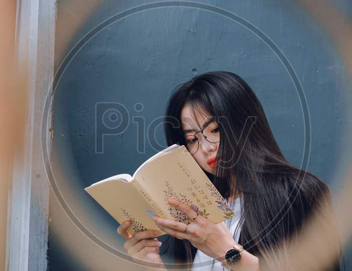 Cute Girl Reading Something