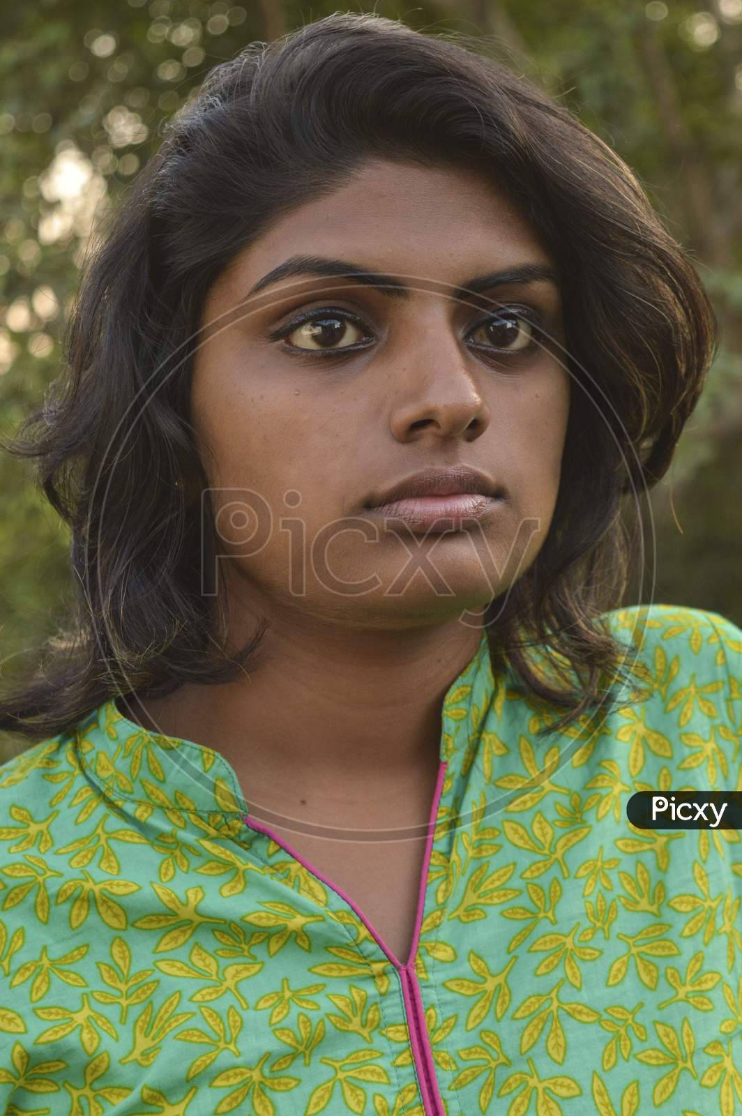 A Indian Girl Poses For Portfolio Shoot At Outside Of Studio.