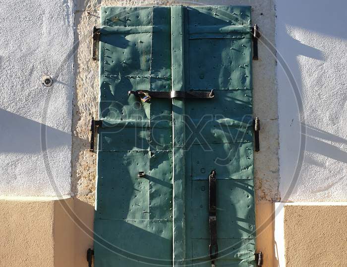 Closed Green Metal Door In Rimetea, Alba, Romania