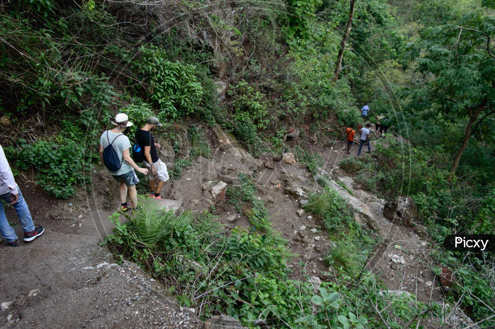 Group Of People Going Down,Trekking, From The Famous Neer Garh Waterfall, Rishikesh, Uttarakhand India.