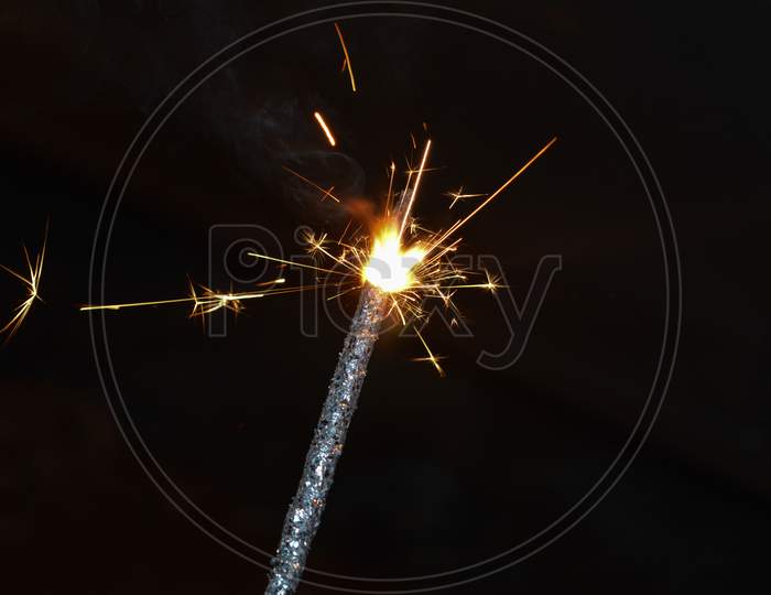 Indian Lady Playing With Fire Cracker Rose And Candle On Indian Festival Diwali Deepawali With Fire Isolated On Table