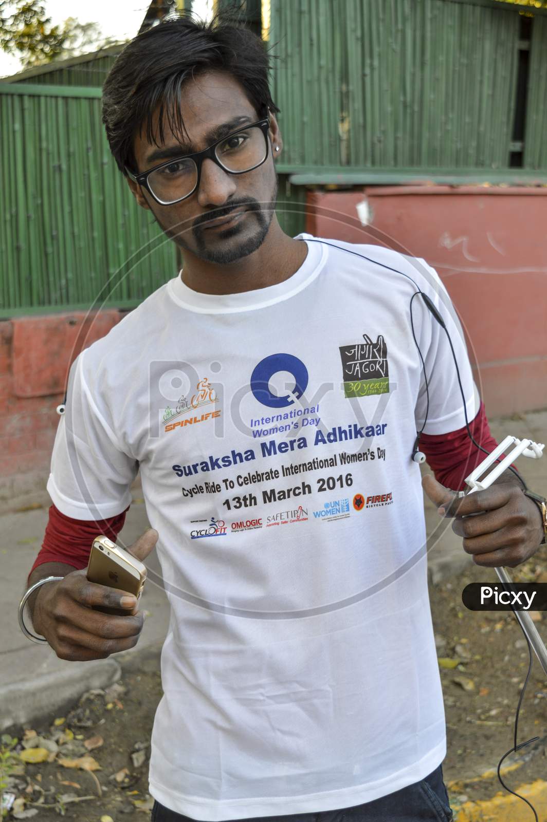 A Indian Boy Poses For Support The Cycle Ride To Celebrate International Women'S Day.