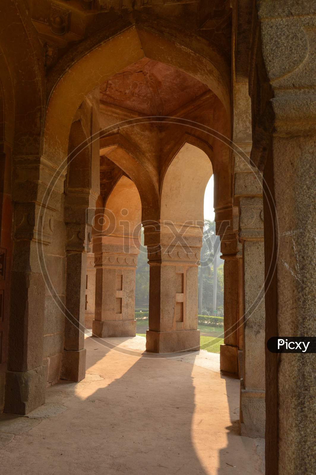 A Design Inside Of Tomb Of Sikandar Lodhi Monument At Lodi Garden Or Lodhi Gardens In A City Park From The Side Of The Lawn At Winter Foggy Morning.
