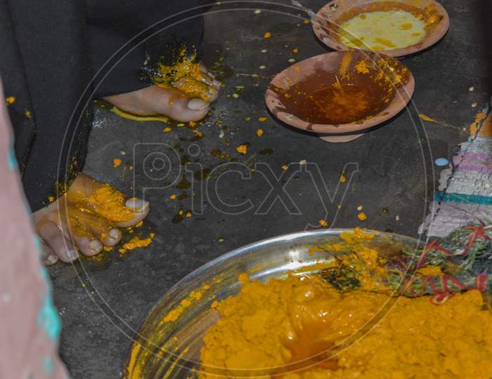Closeup Shot Of Bride Feet On Haldi(Turmeric) Ceremony In One Of The Ritual In Indian Marriage.
