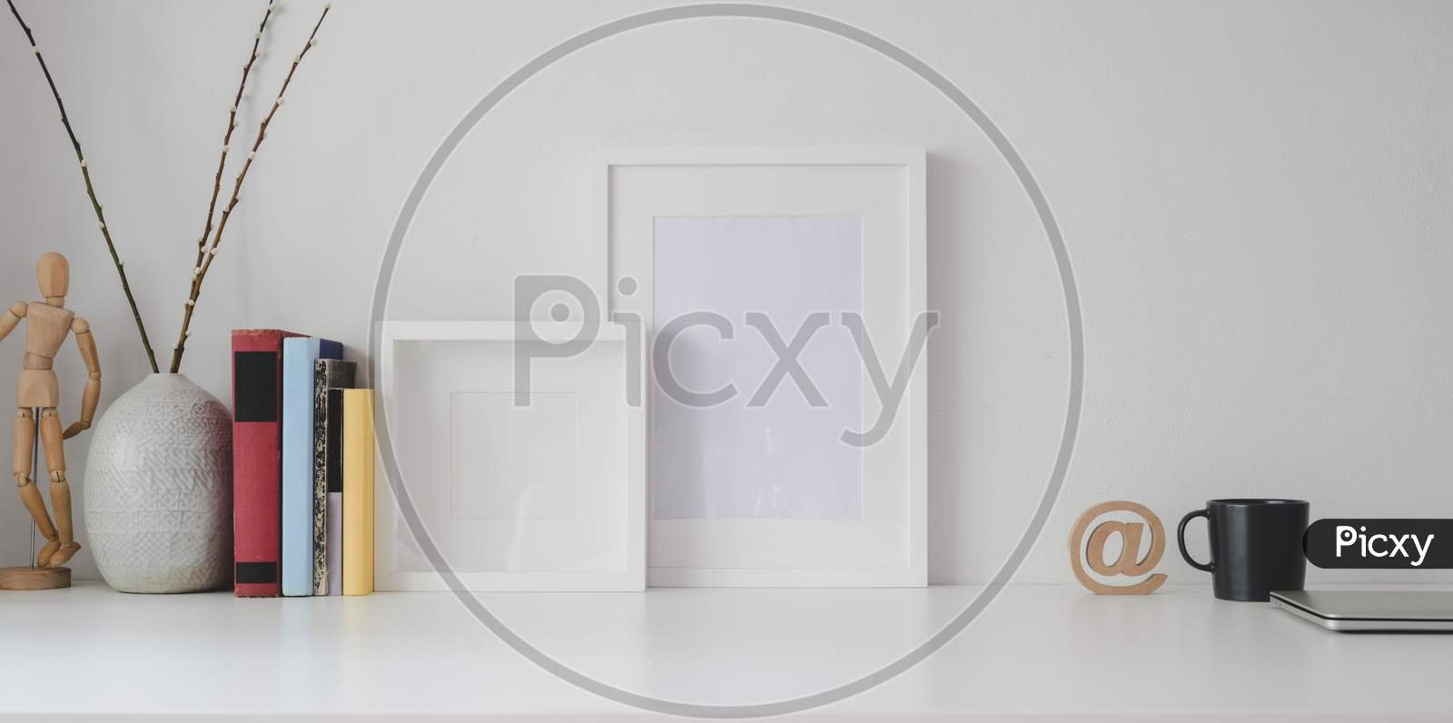 Minimal Workspace With Mock Up Frame And Office Supplies On White Wooden Table