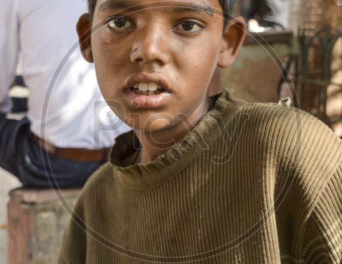 A Indian Child Beggar Asking For Money For Buying Food.