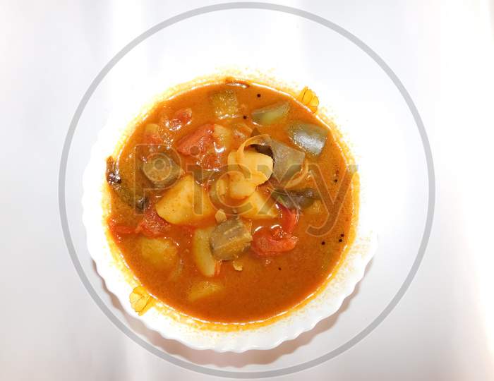 Delicious Dish(Sambar)In A Bowl Isolated On A White Surface