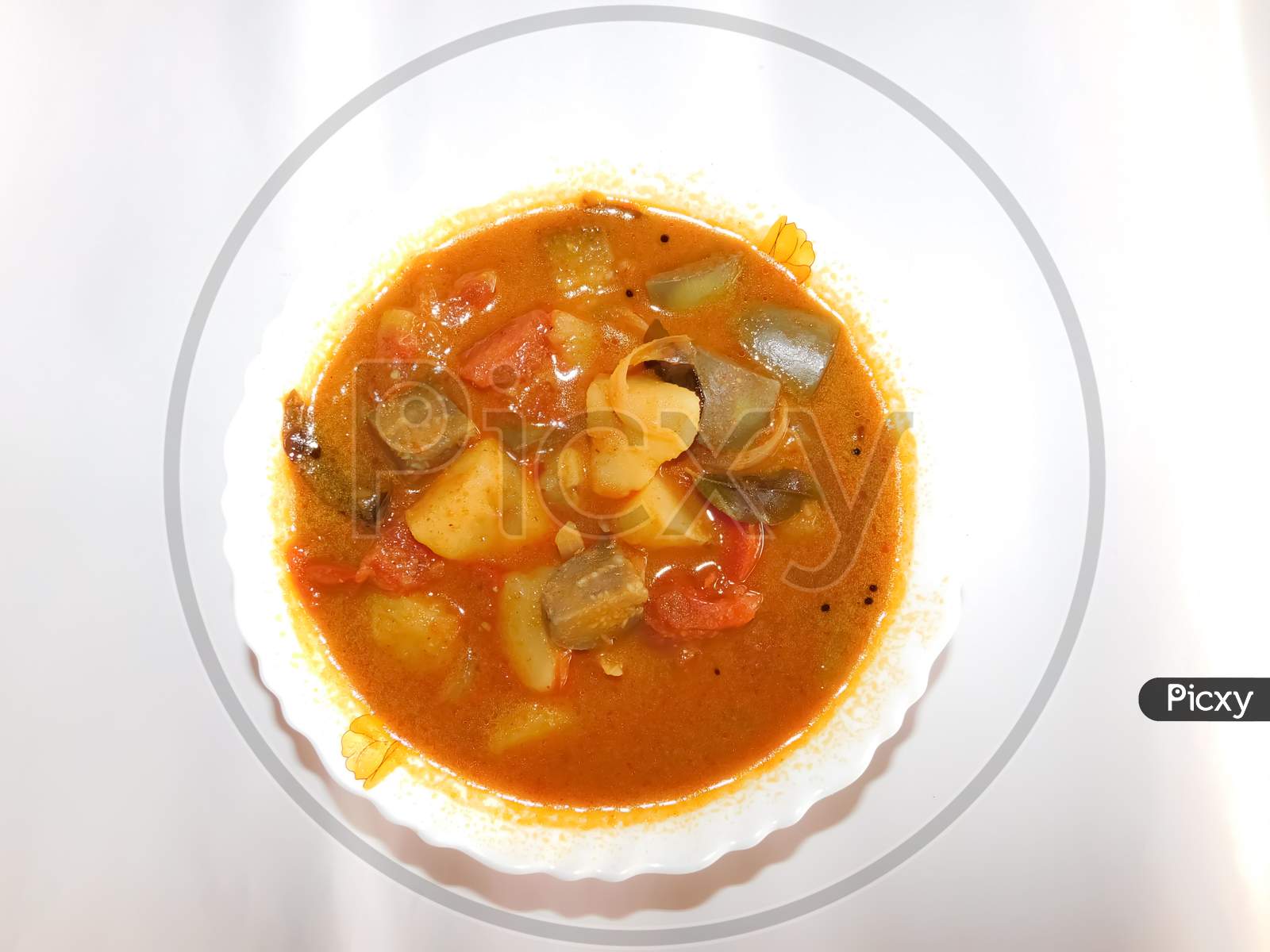 Delicious Dish(Sambar)In A Bowl Isolated On A White Surface