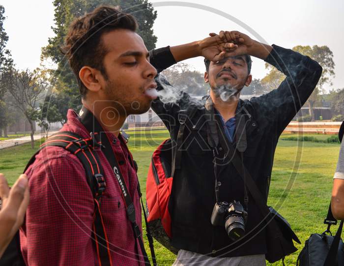A Portrait Of Students Who Is Smoking Cigarette At Morning Shoot Outside Of Safderjung Tomb.