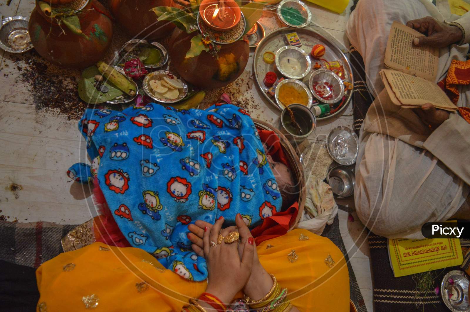 Indian Ritual Baby Lying On Wooden Pan On Ritual Of Namkaran